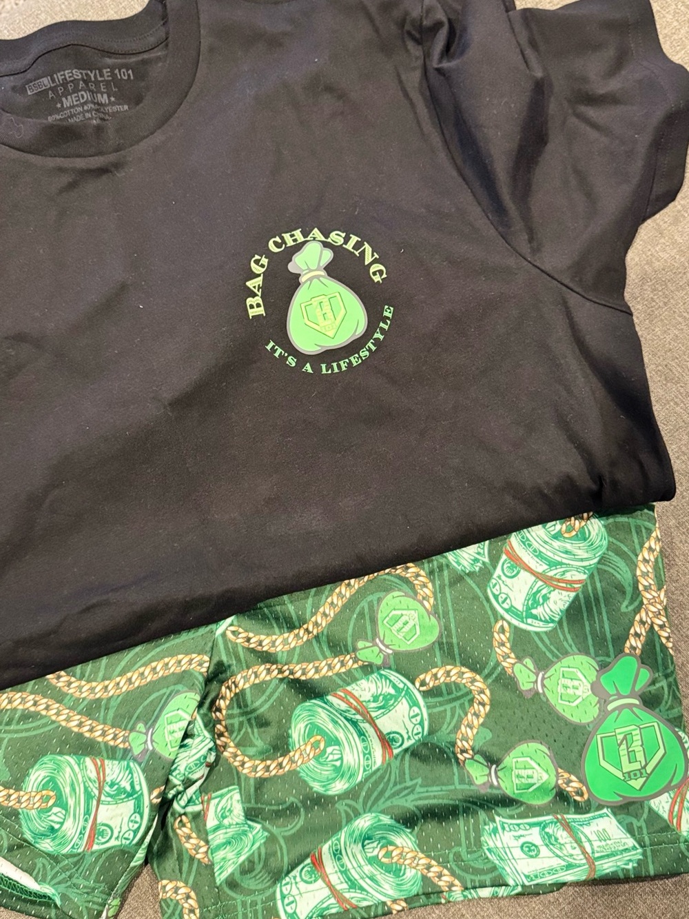 Bag Chasing Men's Black Short Sleeve Tee with Green Logo